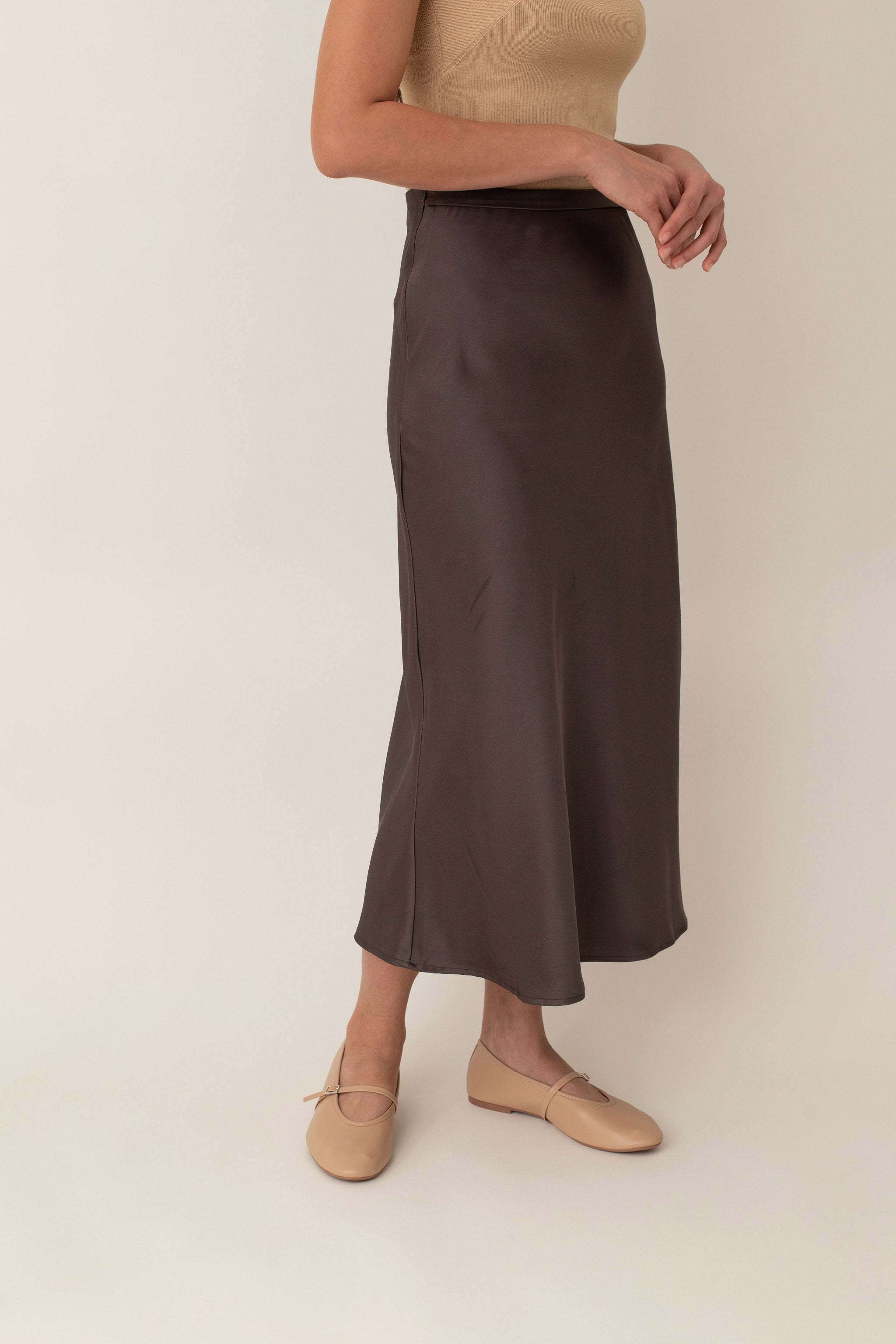 Crafted from silky fabric that feels smooth to the touch and features a subtle, beautiful sheen, the Thalia skirt flares gently from the waist. This design creates a flattering, flowy silhouette that moves gracefully with you.